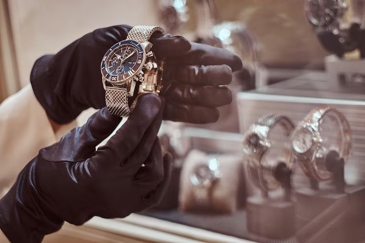 close-up-seller-s-hands-gloves-shows-exclusive-men-s-watch-from-new-collection-luxury-jewelry-store_613910-20850